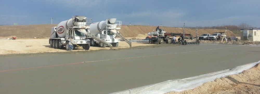 Picture of our cement mixers and placement conveyor at the job site